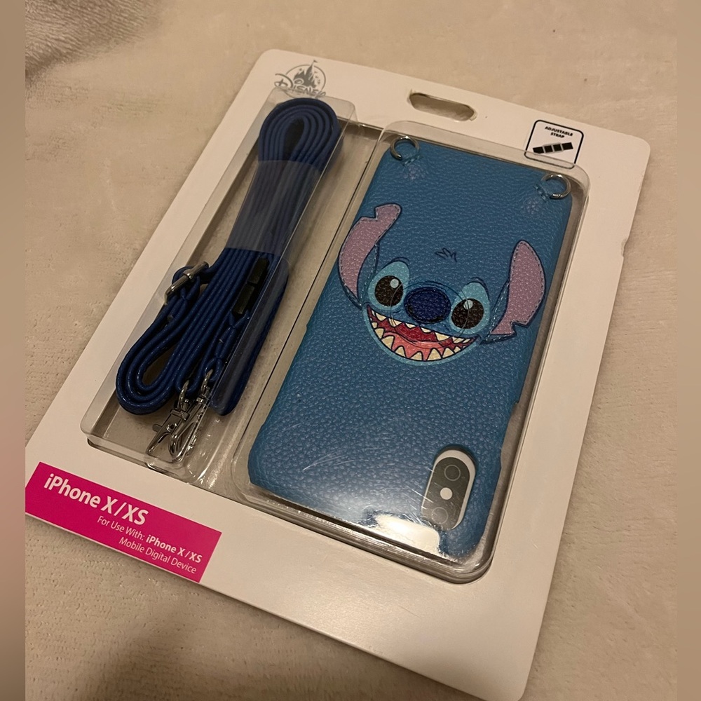 iPhone X/XS Stitch phone case with adjustable strap, brand new.